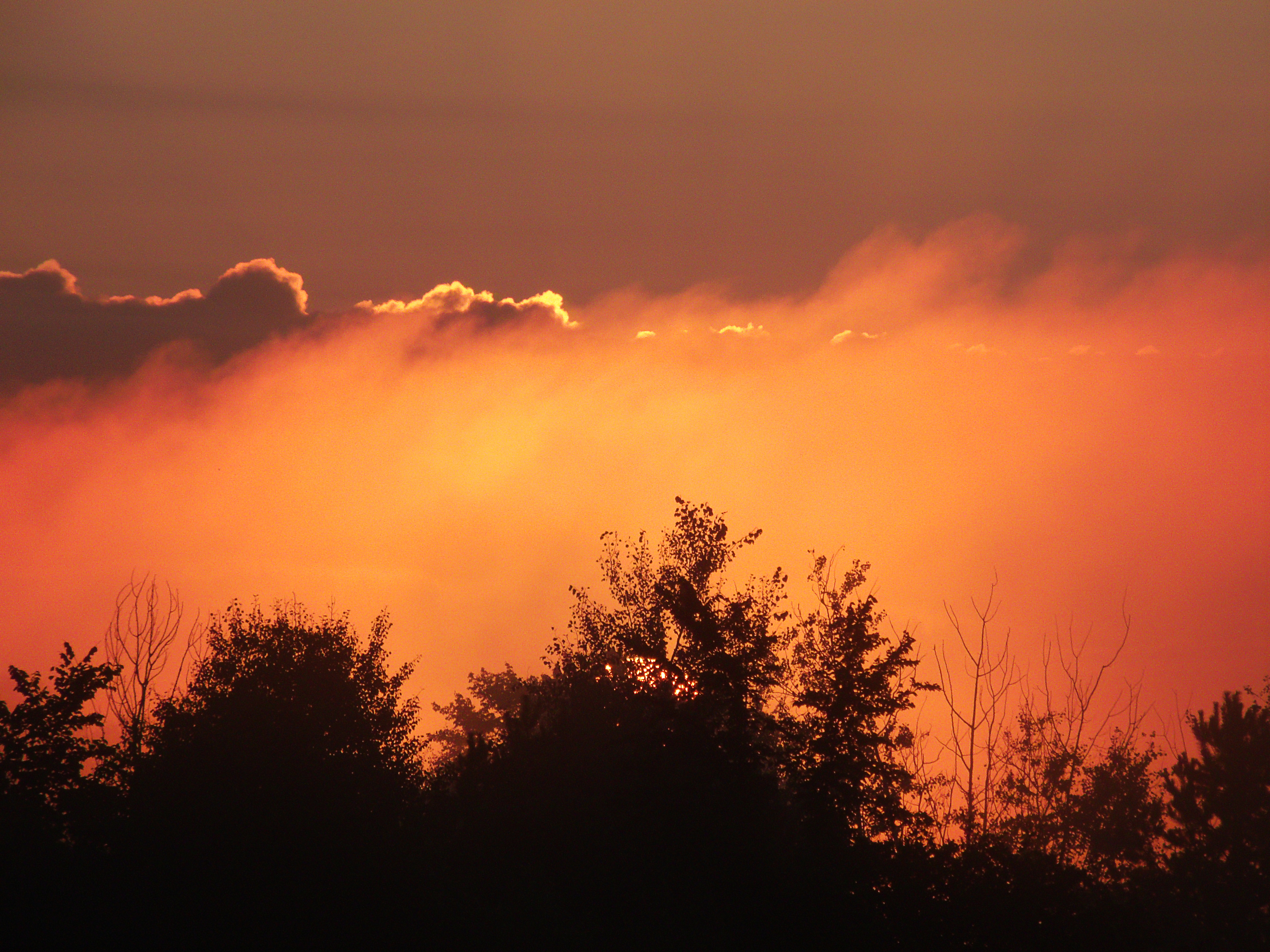blazing-sunset blazing sunset through the clouds